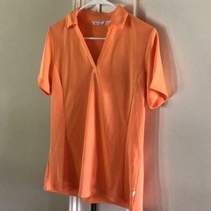 Lady Hagen tangerine golf shirt medium.  Size M